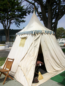 Old tent parked outside of one of the trailers