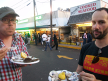 The men folk eating raw oysters