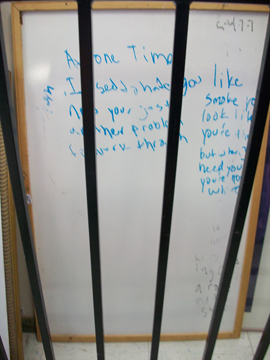 The whole white board behind a stair railing for sale for $3.99