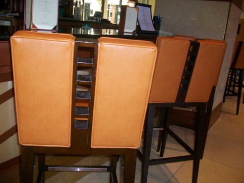 Orange leather chair at the bar