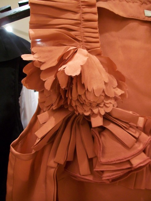 Flower and ruffle details on a blouse